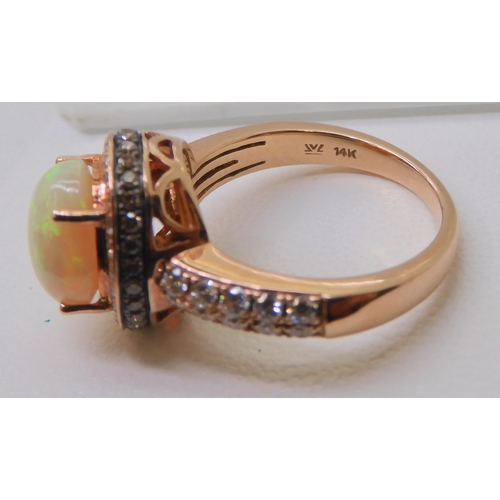 2816 - A LE VIAN OPAL & DIAMOND RINGmounted in 14k rose gold, and set with estimated approx 0.50cts of ... 