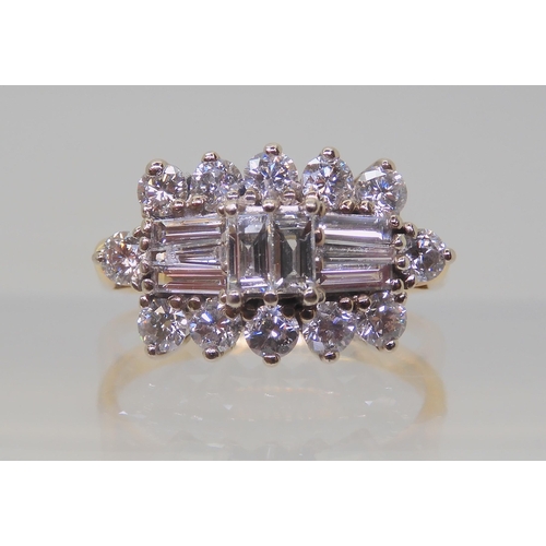 2817 - A DIAMOND CLUSTER RINGmounted in 18ct yellow and white gold and set with brilliant and baguette diam... 