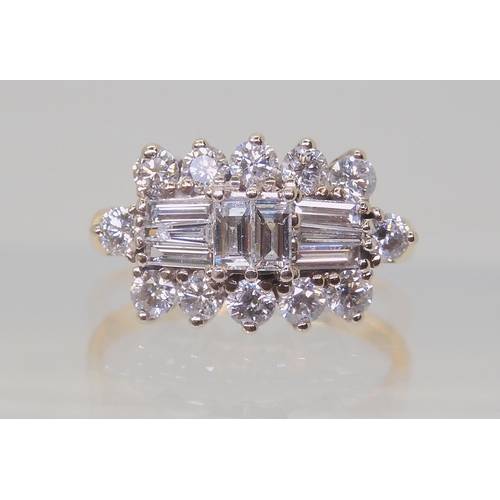 2817 - A DIAMOND CLUSTER RINGmounted in 18ct yellow and white gold and set with brilliant and baguette diam... 