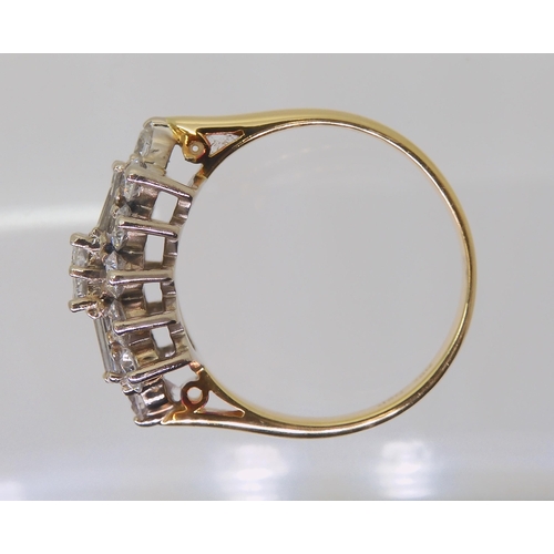 2817 - A DIAMOND CLUSTER RINGmounted in 18ct yellow and white gold and set with brilliant and baguette diam... 