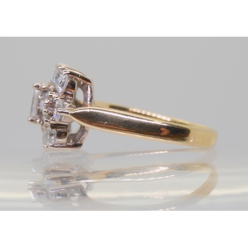 2817 - A DIAMOND CLUSTER RINGmounted in 18ct yellow and white gold and set with brilliant and baguette diam... 