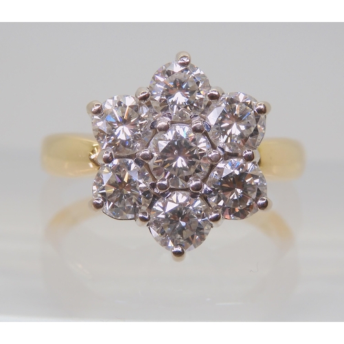 2821 - A SUBSTANTIAL DIAMOND FLOWER RINGthe 18ct gold mount is set with estimated approx 1.5cts of brillian... 