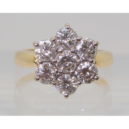 2821 - A SUBSTANTIAL DIAMOND FLOWER RINGthe 18ct gold mount is set with estimated approx 1.5cts of brillian... 