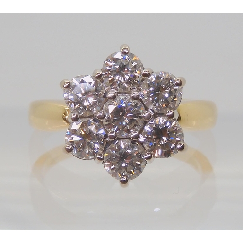 2821 - A SUBSTANTIAL DIAMOND FLOWER RINGthe 18ct gold mount is set with estimated approx 1.5cts of brillian... 