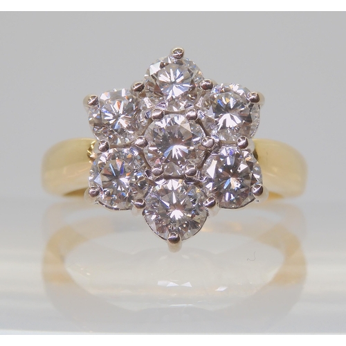 2821 - A SUBSTANTIAL DIAMOND FLOWER RINGthe 18ct gold mount is set with estimated approx 1.5cts of brillian... 