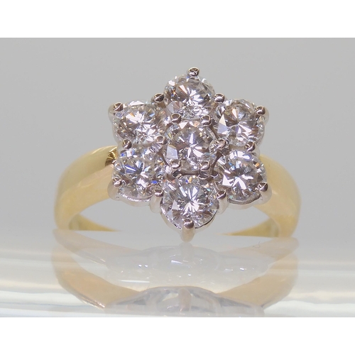 2821 - A SUBSTANTIAL DIAMOND FLOWER RINGthe 18ct gold mount is set with estimated approx 1.5cts of brillian... 