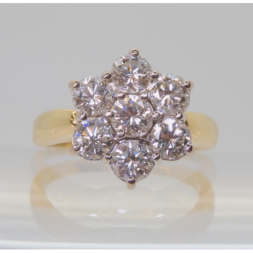 2821 - A SUBSTANTIAL DIAMOND FLOWER RINGthe 18ct gold mount is set with estimated approx 1.5cts of brillian... 