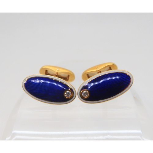 2822 - A PAIR OF FABERGE CUFFLINKSin 18ct gold, guilloche enameled in cobalt blue and white and set with a ... 