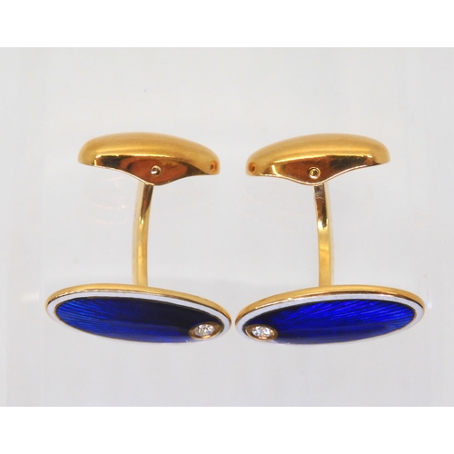 2822 - A PAIR OF FABERGE CUFFLINKSin 18ct gold, guilloche enameled in cobalt blue and white and set with a ... 