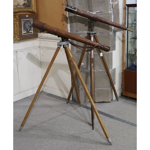 2614 - A MATCHED PAIR OF MILITARY FIELD TELESCOPESProbably WW1-era, two-draw with leather-clad tubes, one b... 