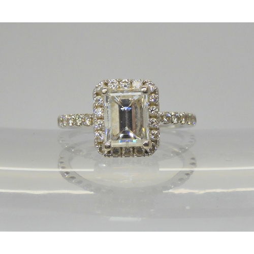 2714 - A 14K WHITE GOLD SUBSTANTIAL DIAMOND RINGset with an estimated approx 1.40ct step cut diamond, with ... 