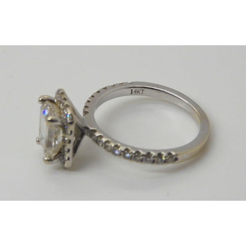 2714 - A 14K WHITE GOLD SUBSTANTIAL DIAMOND RINGset with an estimated approx 1.40ct step cut diamond, with ... 