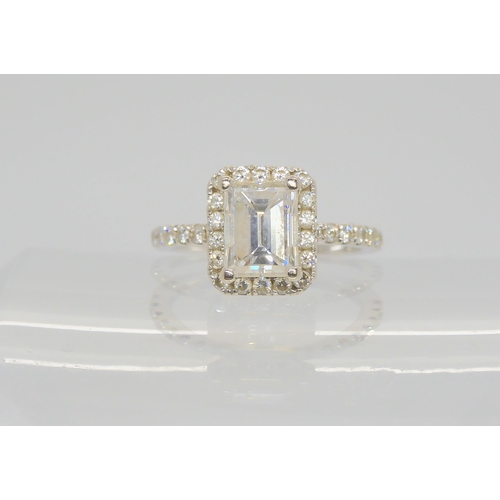 2714 - A 14K WHITE GOLD SUBSTANTIAL DIAMOND RINGset with an estimated approx 1.40ct step cut diamond, with ... 