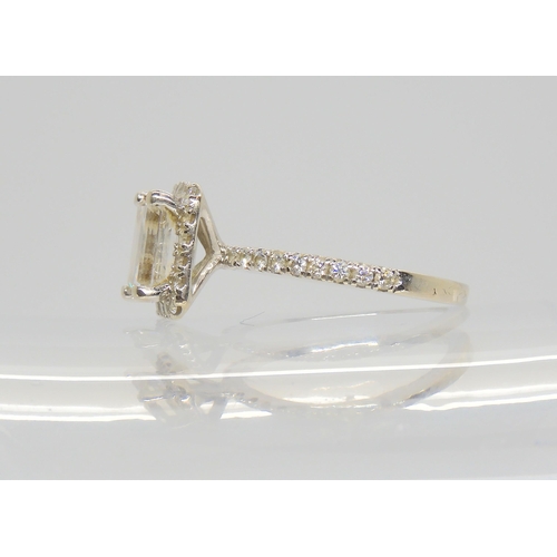 2714 - A 14K WHITE GOLD SUBSTANTIAL DIAMOND RINGset with an estimated approx 1.40ct step cut diamond, with ... 