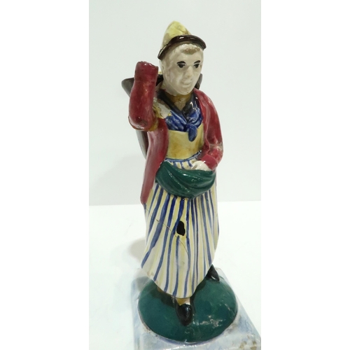 275 - A Scottish pottery figure modelled as a fisherwoman, carrying a creel on her back