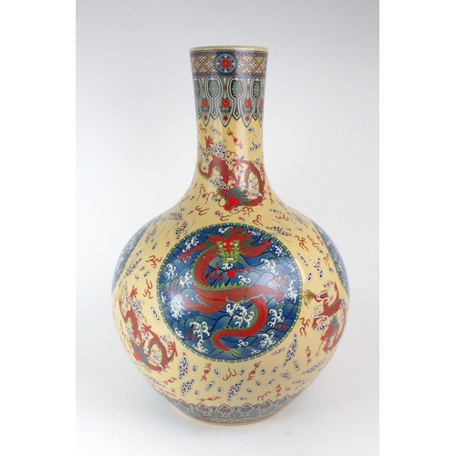 307 - A MODERN CHINESE BALUSTER VASEPainted and printed with roundels of pearls on foaming seas, divided b... 