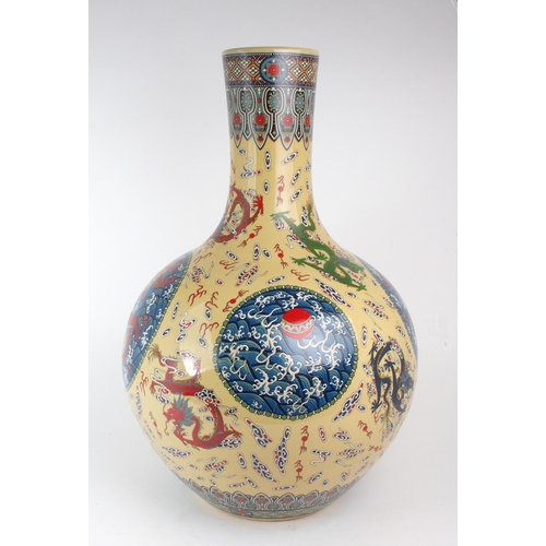 307 - A MODERN CHINESE BALUSTER VASEPainted and printed with roundels of pearls on foaming seas, divided b... 