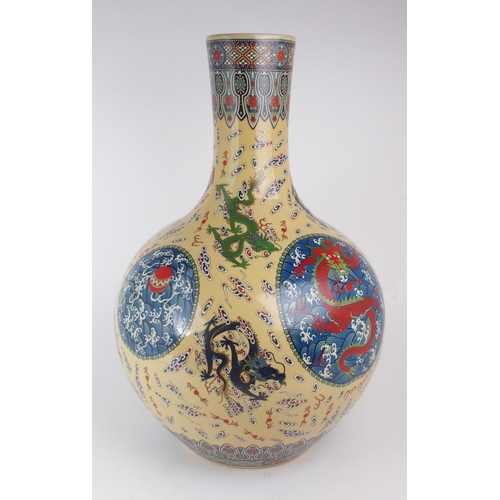 307 - A MODERN CHINESE BALUSTER VASEPainted and printed with roundels of pearls on foaming seas, divided b... 