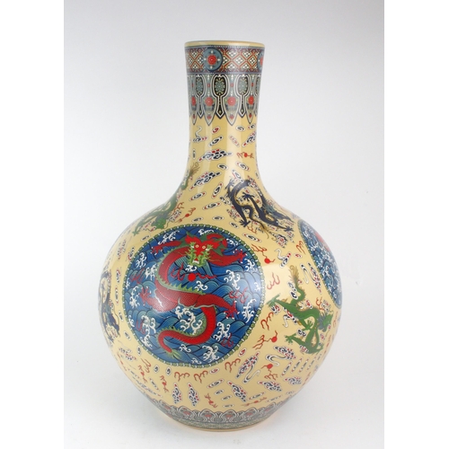 307 - A MODERN CHINESE BALUSTER VASEPainted and printed with roundels of pearls on foaming seas, divided b... 