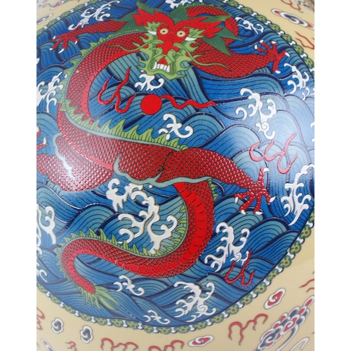 307 - A MODERN CHINESE BALUSTER VASEPainted and printed with roundels of pearls on foaming seas, divided b... 