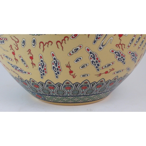 307 - A MODERN CHINESE BALUSTER VASEPainted and printed with roundels of pearls on foaming seas, divided b... 