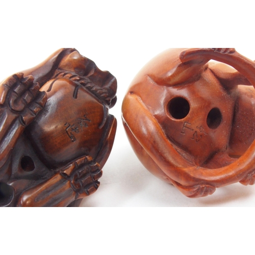 312 - A collection of Japanese fruitwood netsuke, one carved as a swan, the other as a monkey clutching a ... 