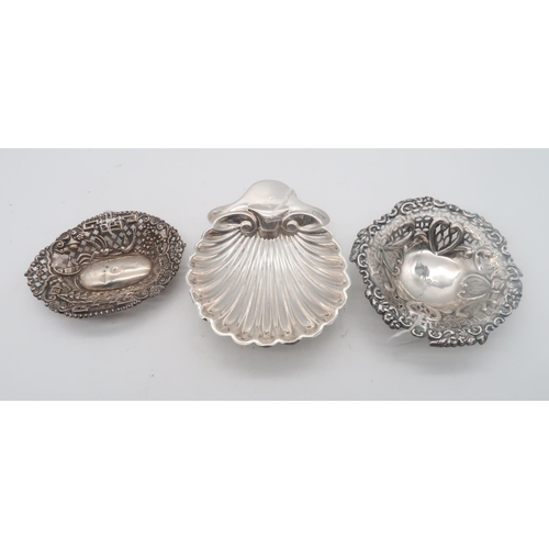 433 - A silver scallop butter dish, by Josiah Williams & Co, London 1895, a silver bon bon dish, ... 