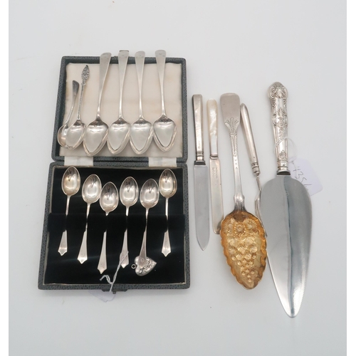 435 - A collection of silver flatware including a berried Georgian silver spoon, London 1811, a cased set ... 