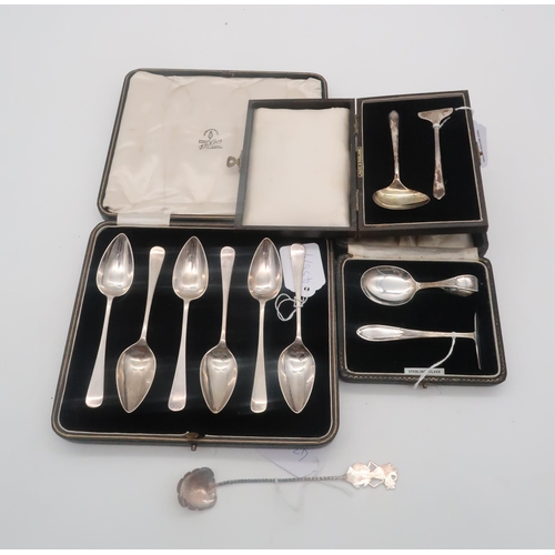 438 - A cased set of silver tea spoons, by Charles James Allan, Sheffield 1930, two cased silver pusher an... 