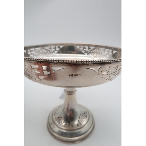 439 - A pair of stamped silver comports, the bowl and flaring stem with floral open work, 360gms