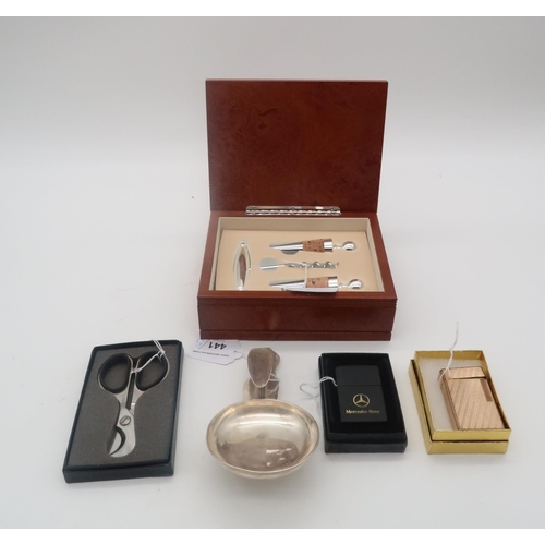 441 - Asprey; a silver car cigar ashtray, London 1909, an Altio cork screw and wine bottle stopper set, a ... 