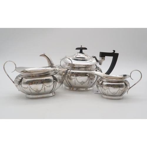 444 - An Edwardian three piece silver tea service, by Joseph Gloster Ltd, Birmingham 1908, of lobed form, ... 