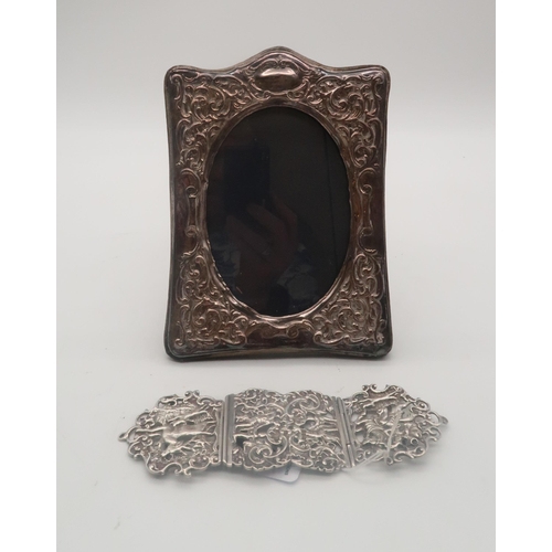 447 - A Victorian silver belt buckle, by Thomas Hayes, London 1878, finely cast with a hunting scene, and ... 