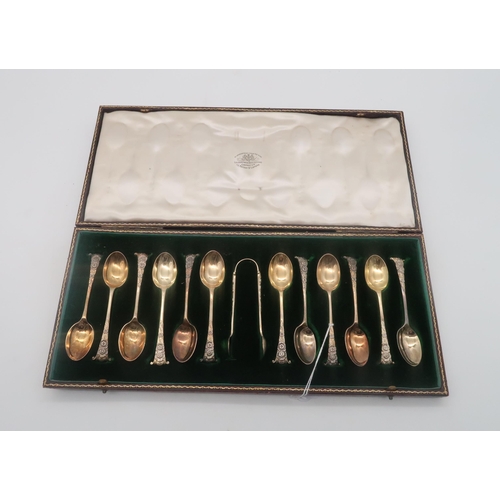 460 - A cased set of silver gilt tea spoons and sugar tongs, by Goldsmiths & Silversmiths Co, London 1... 