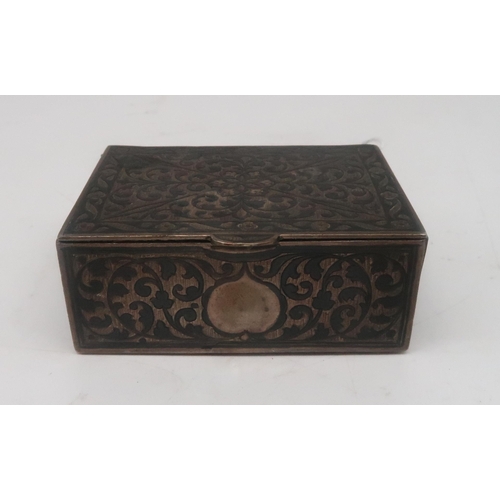 466 - An Eastern white metal niello box, with symmetrical scrolling foliate decoration, 79gms