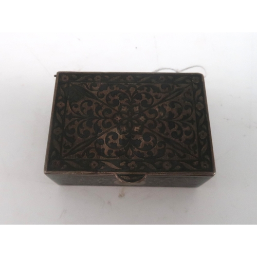 466 - An Eastern white metal niello box, with symmetrical scrolling foliate decoration, 79gms