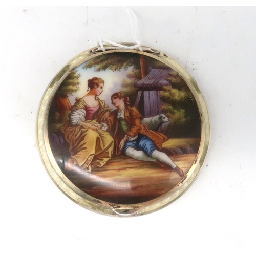 469 - An Austrian silver enamel compact, the lid depicting a courting scene, the reverse with engine turne... 