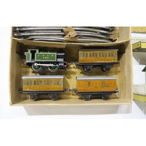 A boxed Hornby clockwork tinplate model train set with locomotive in green LNER livery together wi