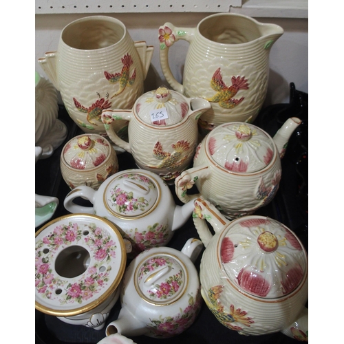 265 - A large collection of Shorter and Son pottery, mainly shell shaped vases, jugs etc, Decoro pottery d... 