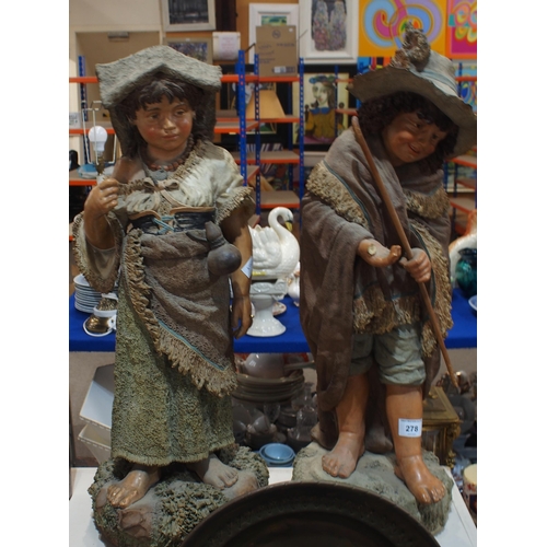 278 - A pair of terracotta figures of children