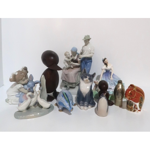 286 - A Royal Doulton ballerina figure Giselle HN2139, a Royal Crown Derby squirrel, a Herend blue sc... 