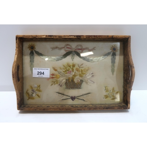 294 - A 19th century silk embroidered tray with gilded leather mounts