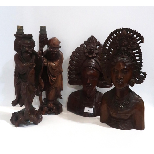 313 - A pair of carved hardwood busts and two Chinese carved wood figural table lamps