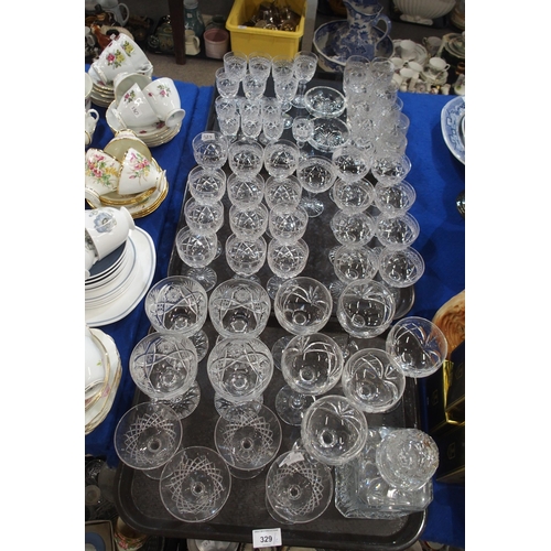 329 - A Stuart crystal part suite of drinking glasses and other glassware