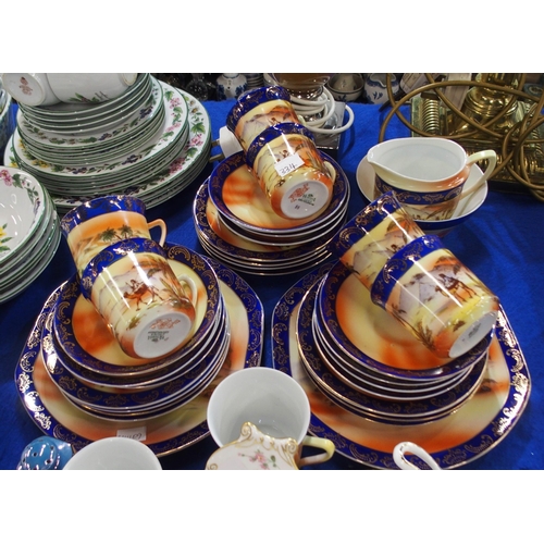 334 - A Victoria China desert scene decorated coffee set, Royal Albert Canterbury cups, Paragon Elegance t... 