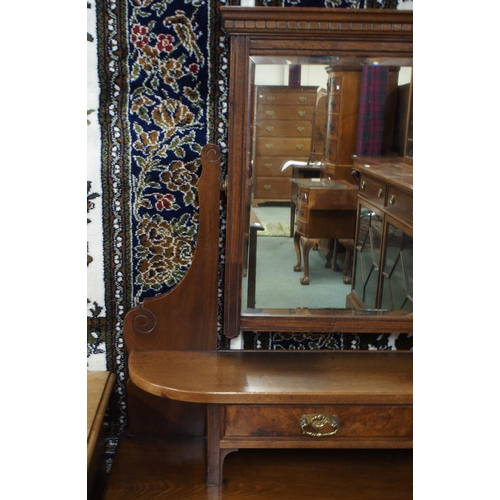 41 - A late Victorian mahogany mirror backed dressing table on turned supports terminating in ceramic cas... 