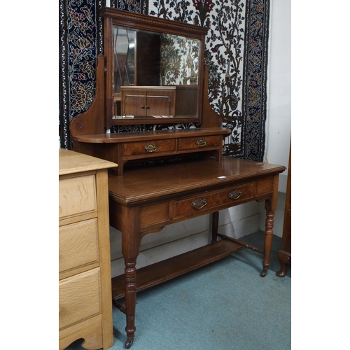 41 - A late Victorian mahogany mirror backed dressing table on turned supports terminating in ceramic cas... 