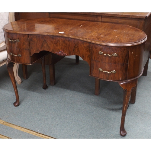 48 - A 20th century kidney shaped dressing table with central frieze drawer flanked by two drawers either... 