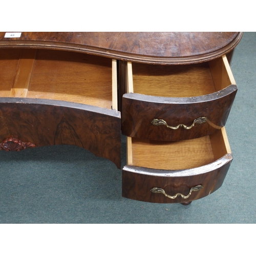 48 - A 20th century kidney shaped dressing table with central frieze drawer flanked by two drawers either... 