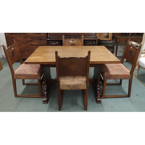 49 - A 20th century French oak dining suite consisting refectory style pull out extending dining table wi... 